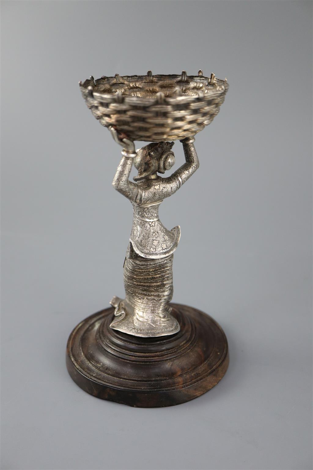 A 19th century Burmese engraved silver figural table salt,